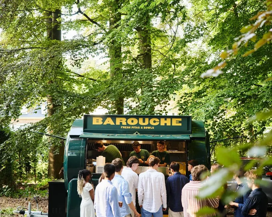 Guests queueing at the Barouche foodtruck at an outdoor event