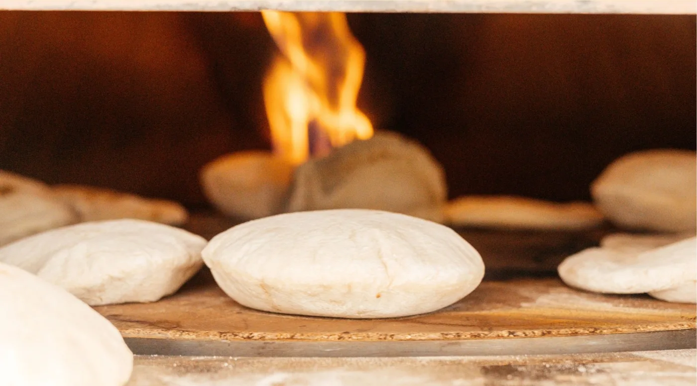 Fresh pitas straight from the oven at our bakery in Ghent